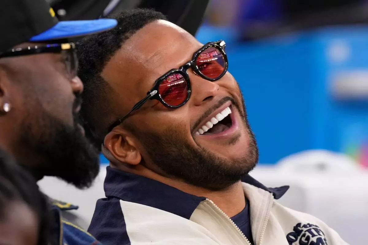 FILE - Former Los Angeles Rams player Aaron Donald looks on before an NFL football game between the Los Angeles Rams and the Tampa Bay Buccaneers, Nov. 23, 2025, in Inglewood, Calif. (AP Photo/Mark J. Terrill, File)