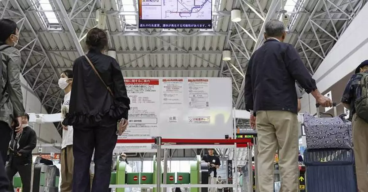 Heavy rain pounds western Japan as 2 tropical storms approach
