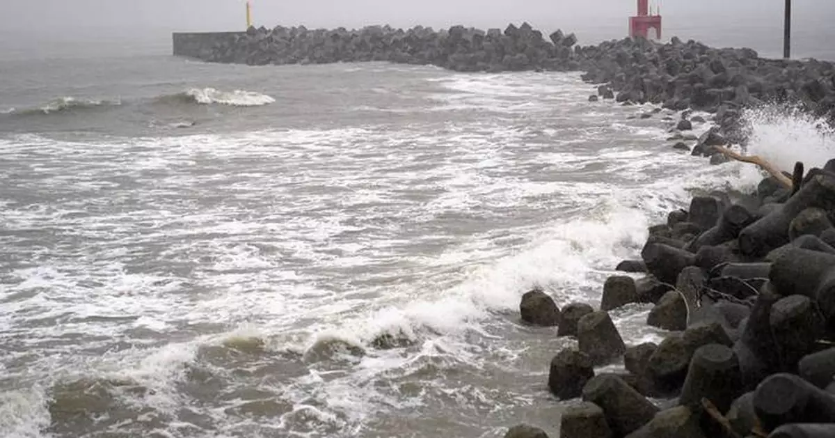 Two tropical storms pound Japan, causing flooding and landslides