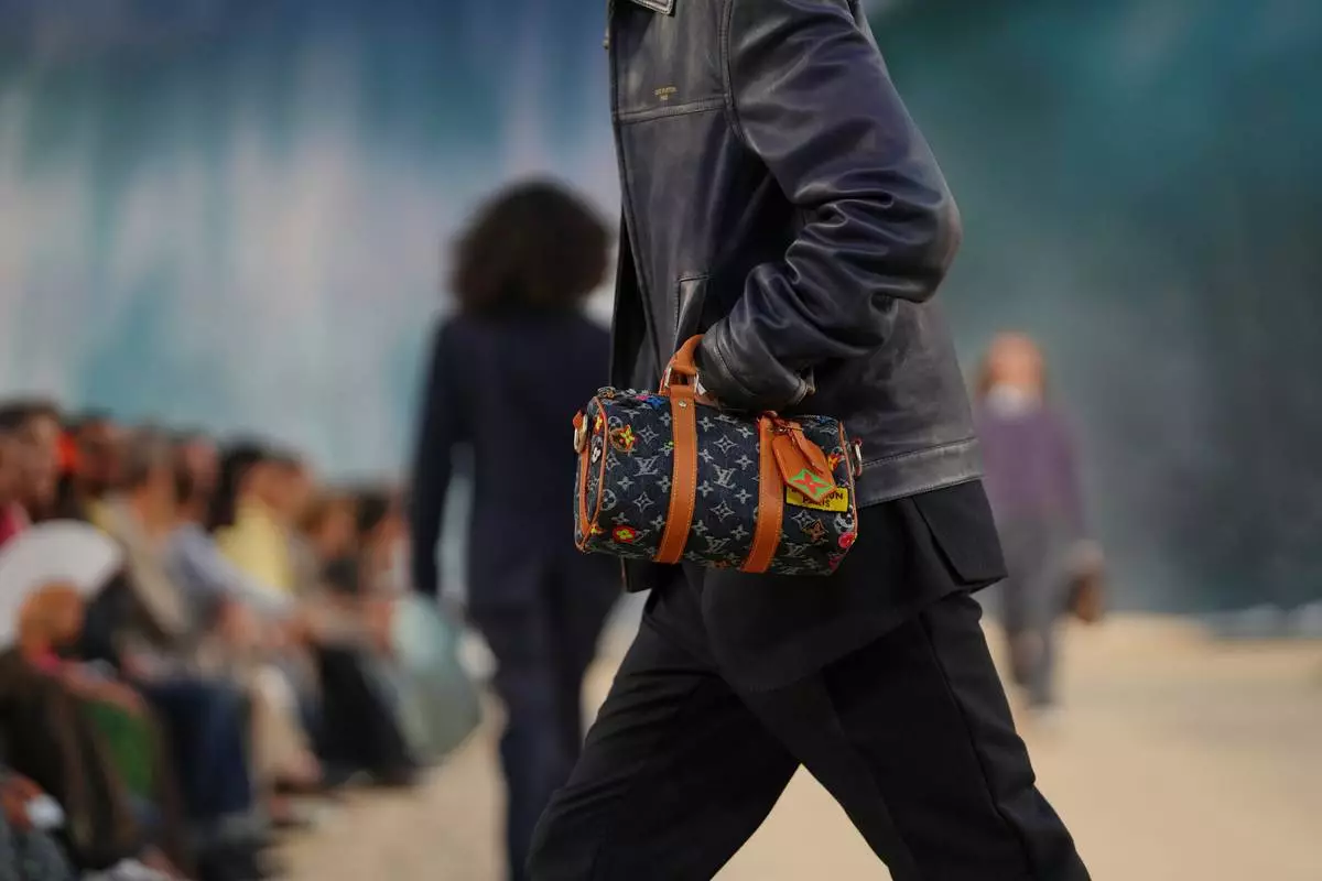 A model wears a creation as part of the Louis Vuitton men's Spring Summer 2027 collection presented in Paris, France, Tuesday, June 23, 2026. (AP Photo/Aurelien Morissard)