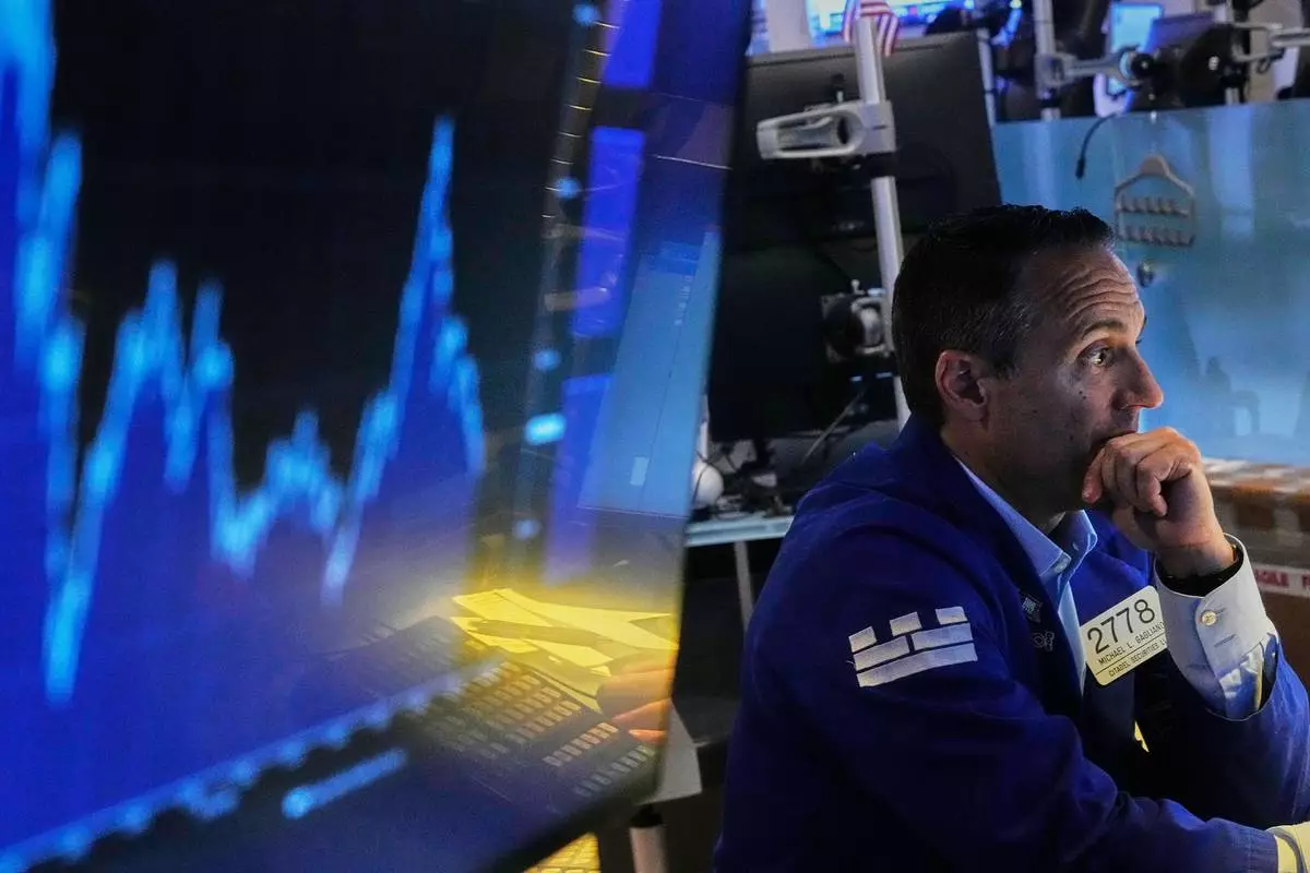 Specialist Michael Gagliano works at his post on the floor of the New York Stock Exchange, Thursday, June 25, 2026. (AP Photo/Richard Drew)
