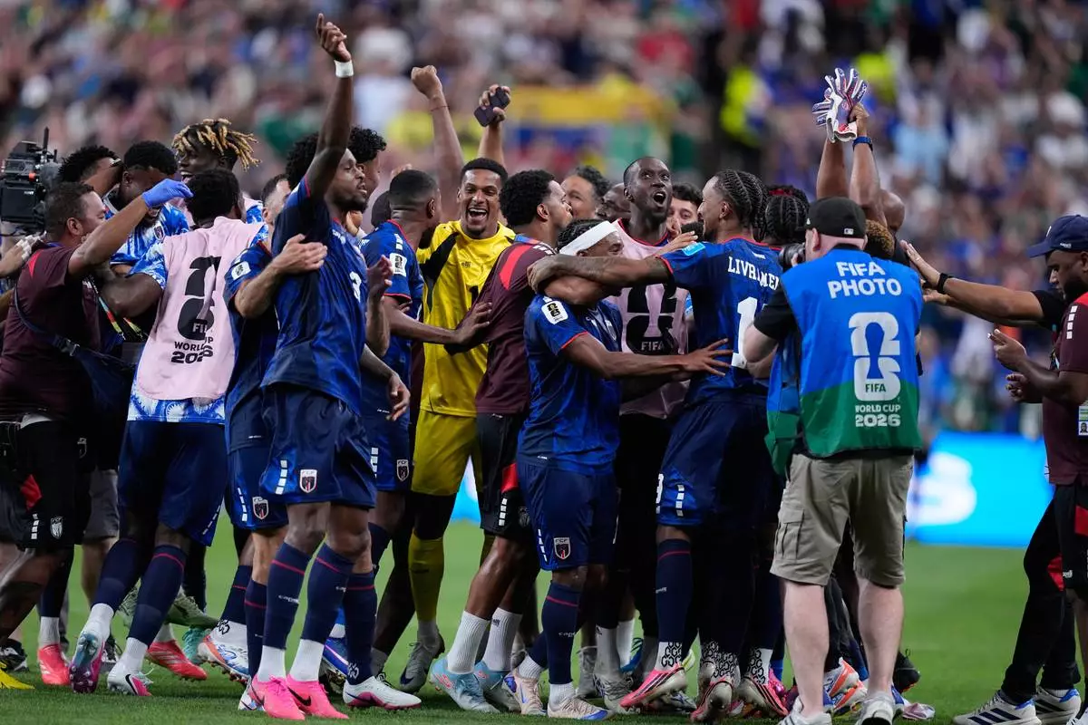 Cape Verde team members celebrate after the World Cup Group H soccer match between Cape Verde and Saudi Arabia in Houston, Friday, June 26, 2026. (AP Photo/Ashley Landis)