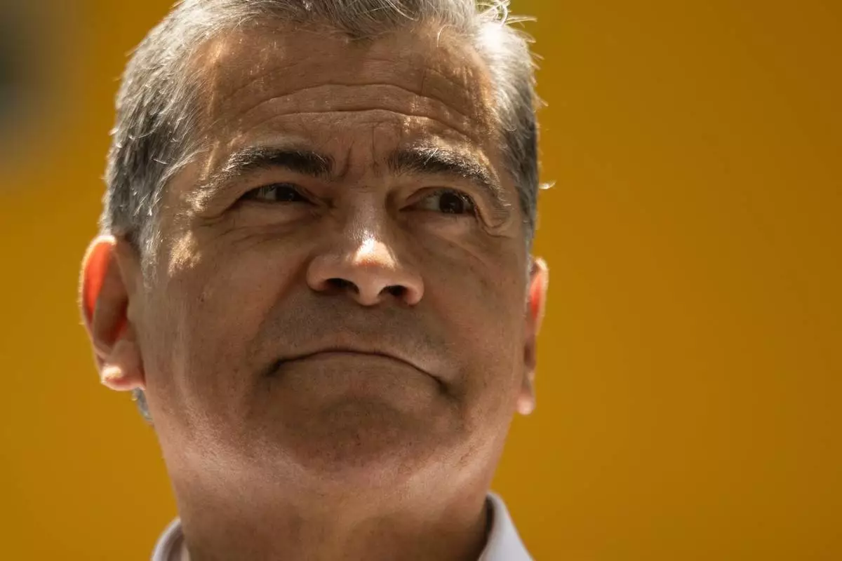 California Gubernatorial candidate Xavier Becerra answers questions from the media following a campaign event Mercado La Paloma on Tuesday, June 9, 2026, in Los Angeles. (AP Photo/Etienne Laurent)
