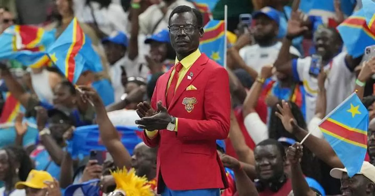 Congo fan who poses as living statue of independence leader Lumumba makes it to World Cup
