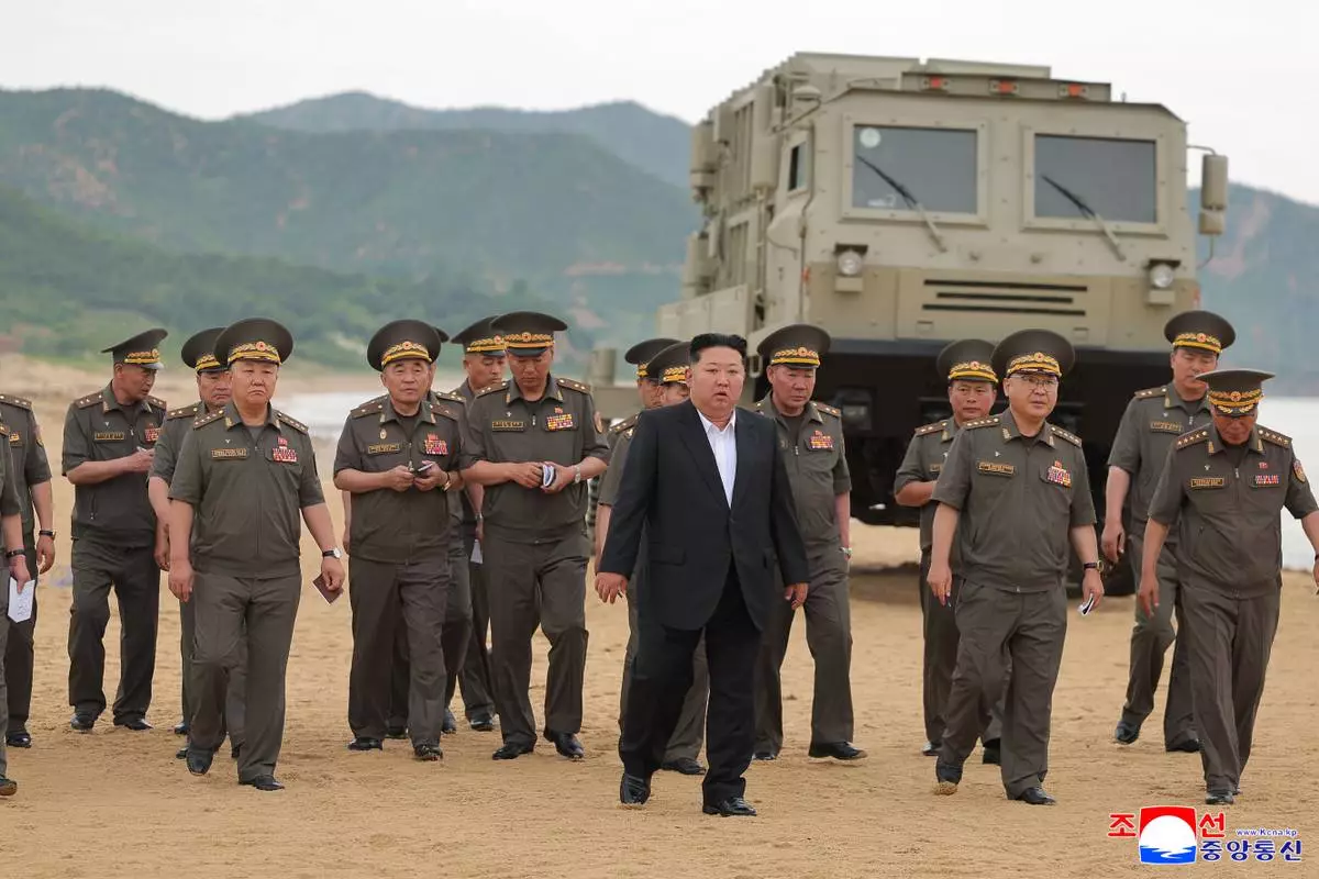 In this photo provided Friday, June 26, 2026, by the North Korean government, its leader Kim Jong Un, center, visits the site of weapon tests at an undisclosed location, North Korea, Thursday, June 25, 2026. Independent journalists were not given access to cover the event depicted in this image distributed by the North Korean government. The content of this image is as provided and cannot be independently verified. Korean language watermark on image as provided by source reads: "KCNA" which is the abbreviation for Korean Central News Agency. (Korean Central News Agency/Korea News Service via AP)