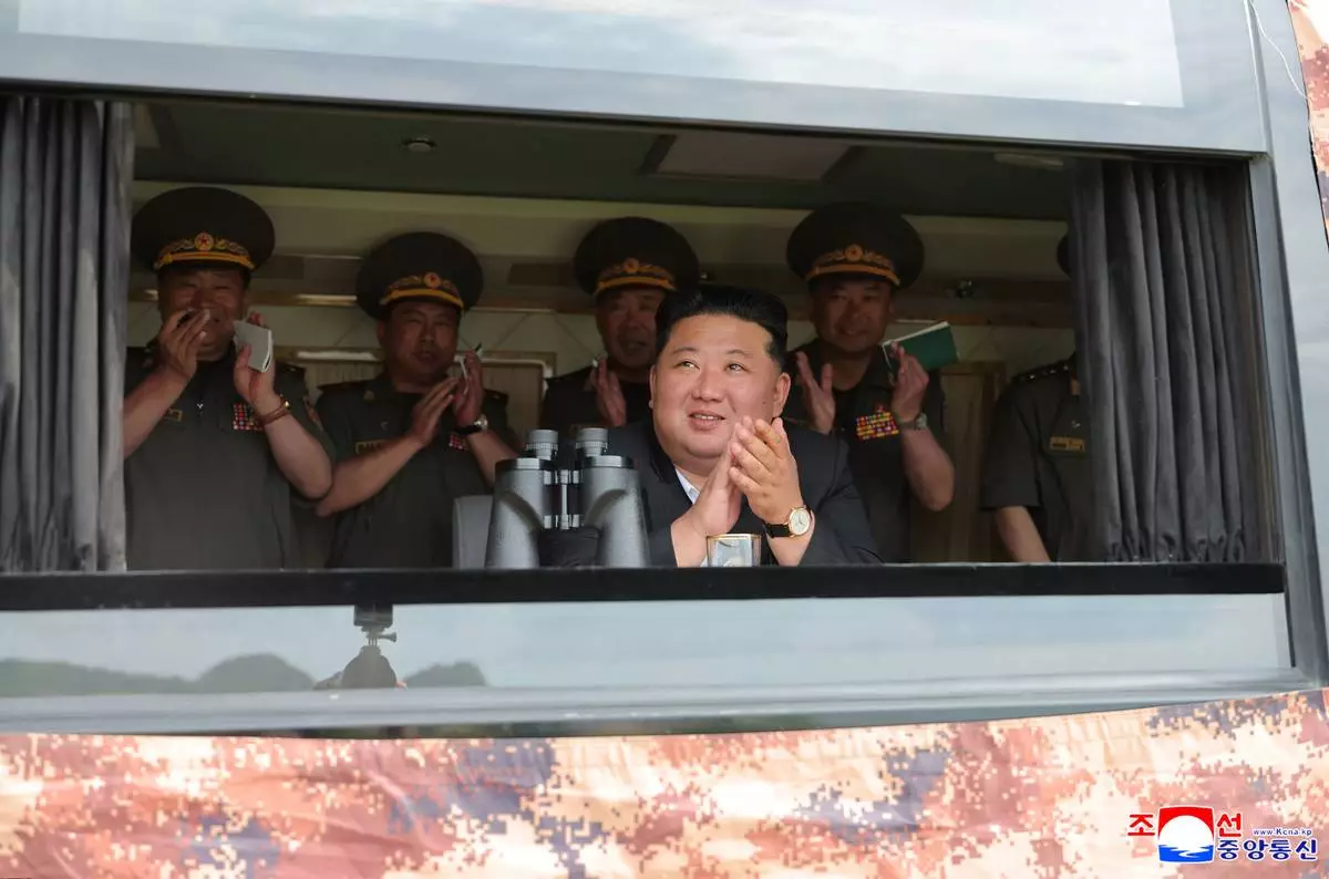 In this photo provided Friday, June 26, 2026, by the North Korean government, its leader Kim Jong Un, center, observes the weapon tests at an undisclosed location, North Korea, Thursday, June 25, 2026. Independent journalists were not given access to cover the event depicted in this image distributed by the North Korean government. The content of this image is as provided and cannot be independently verified. Korean language watermark on image as provided by source reads: "KCNA" which is the abbreviation for Korean Central News Agency. (Korean Central News Agency/Korea News Service via AP)