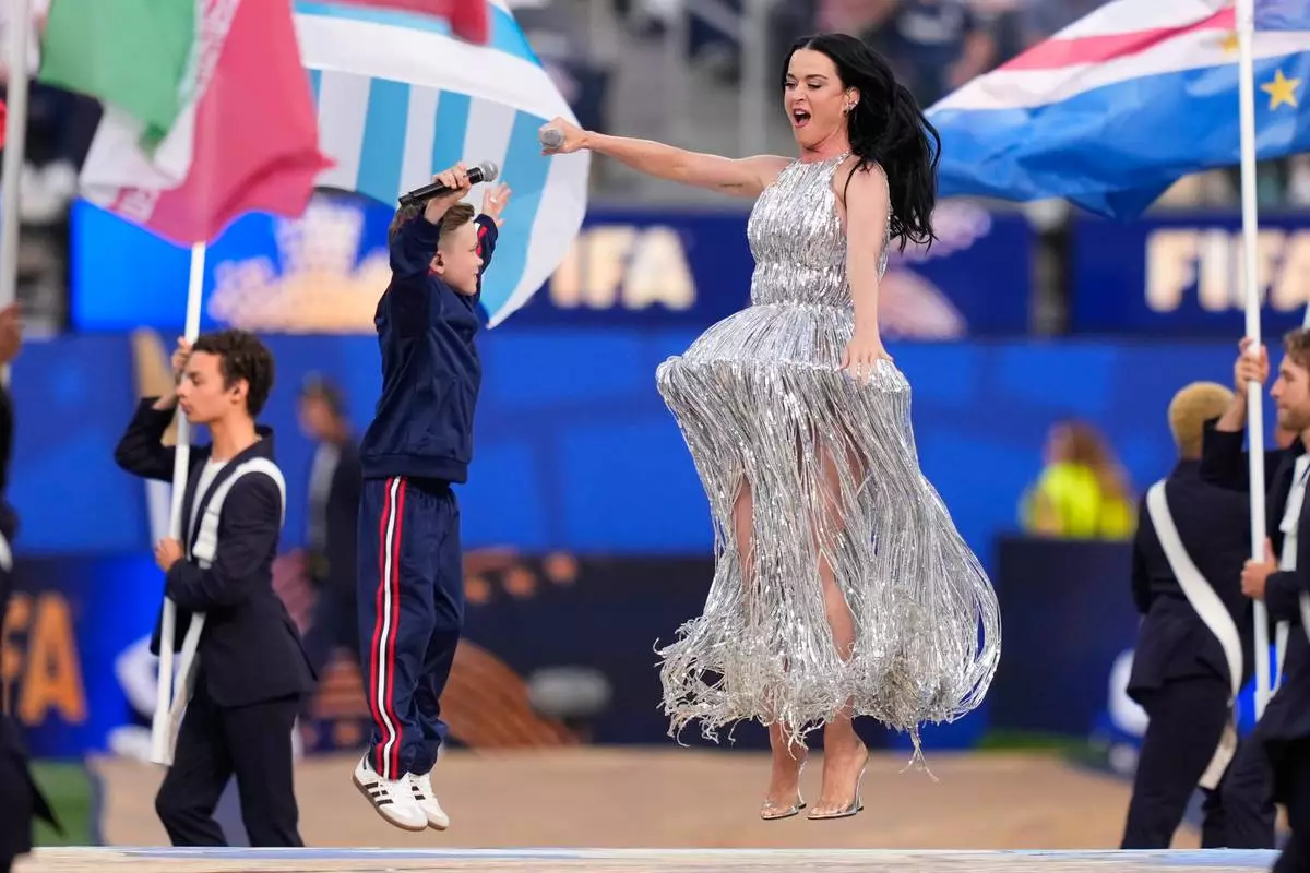 Katy Perry and Tius Luka perform during the opening ceremony ahead of the World Cup Group D soccer match between the United States and Paraguay in Inglewood, Calif., near Los Angeles, Friday, June 12, 2026. (AP Photo/Mark J. Terrill)