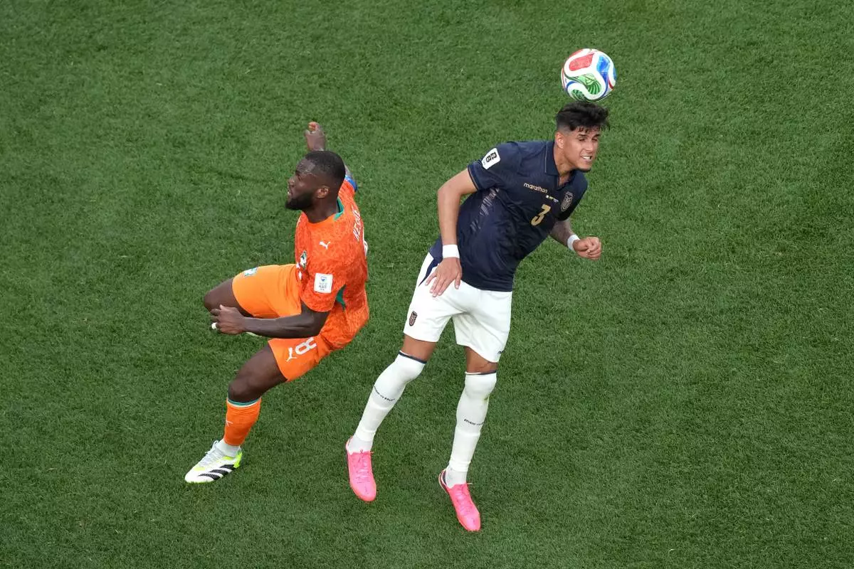 Ecuador's Piero Hincapie (3) heads the ball against Ivory Coast's Franck Kessie (8) during the World Cup Group E soccer match between Ivory Coast and Ecuador in Philadelphia, Sunday, June 14, 2026. (AP Photo/Matt Rourke)