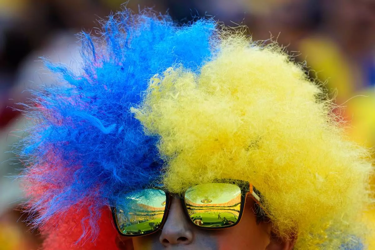 An Ecuadorian fan waits for the beginning of the World Cup Group E soccer match between Ecuador and Curacao in Kansas City, Mo., Saturday, June 20, 2026. (AP Photo/Charlie Riedel)