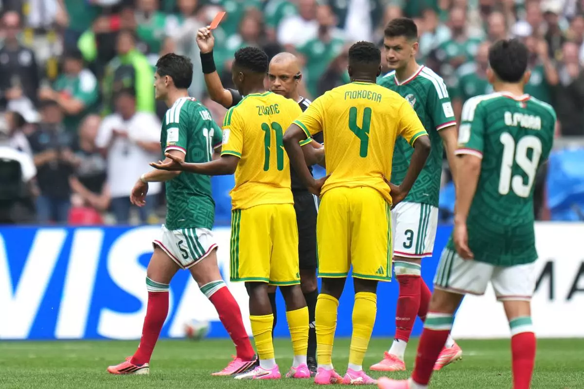 South Africa's Themba Zwane (11) receives a red card from referee Wilton Sampaio, of Brazil, in the second half during the World Cup Group A soccer match between Mexico and South Africa in Mexico City, Thursday, June 11, 2026. (AP Photo/Eduardo Verdugo)