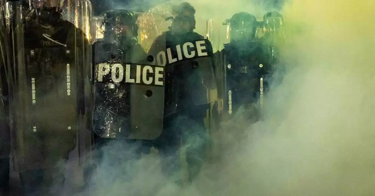 New Jersey police sergeant charged with stealing journalist's camera bag at immigration protest