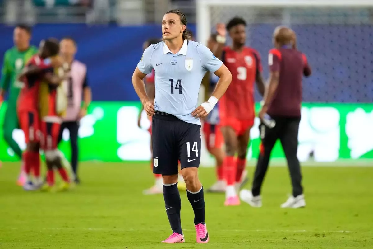 Uruguay's Agustin Canobbio (14) reacts following the World Cup Group H soccer match between Uruguay and Cape Verde in Miami Gardens, Fla., Sunday, June 21, 2026. (AP Photo/Rebecca Blackwell)