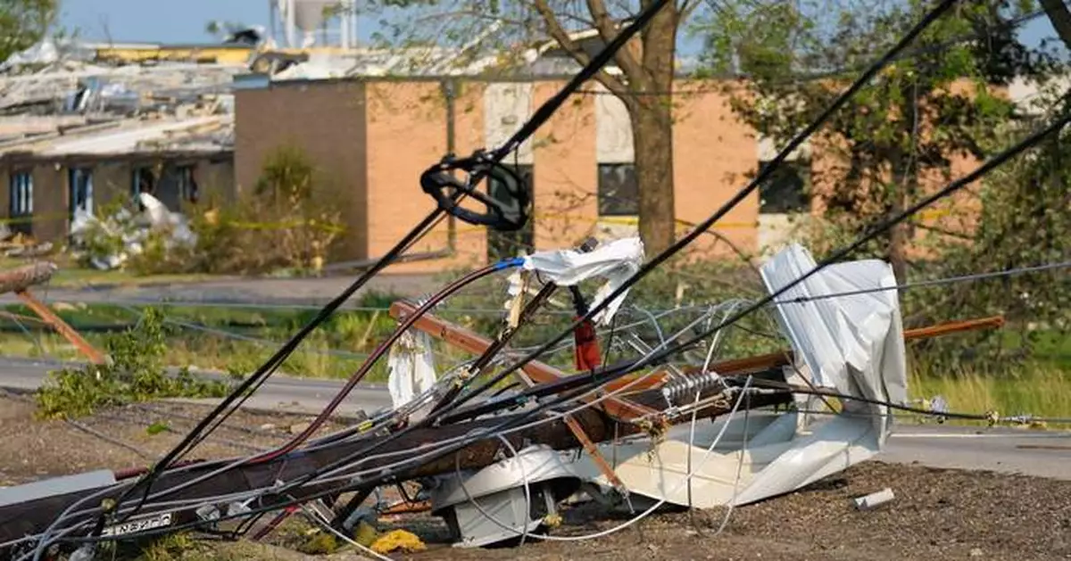 Twisted trees, crushed cars and shattered homes in Wisconsin, in photos