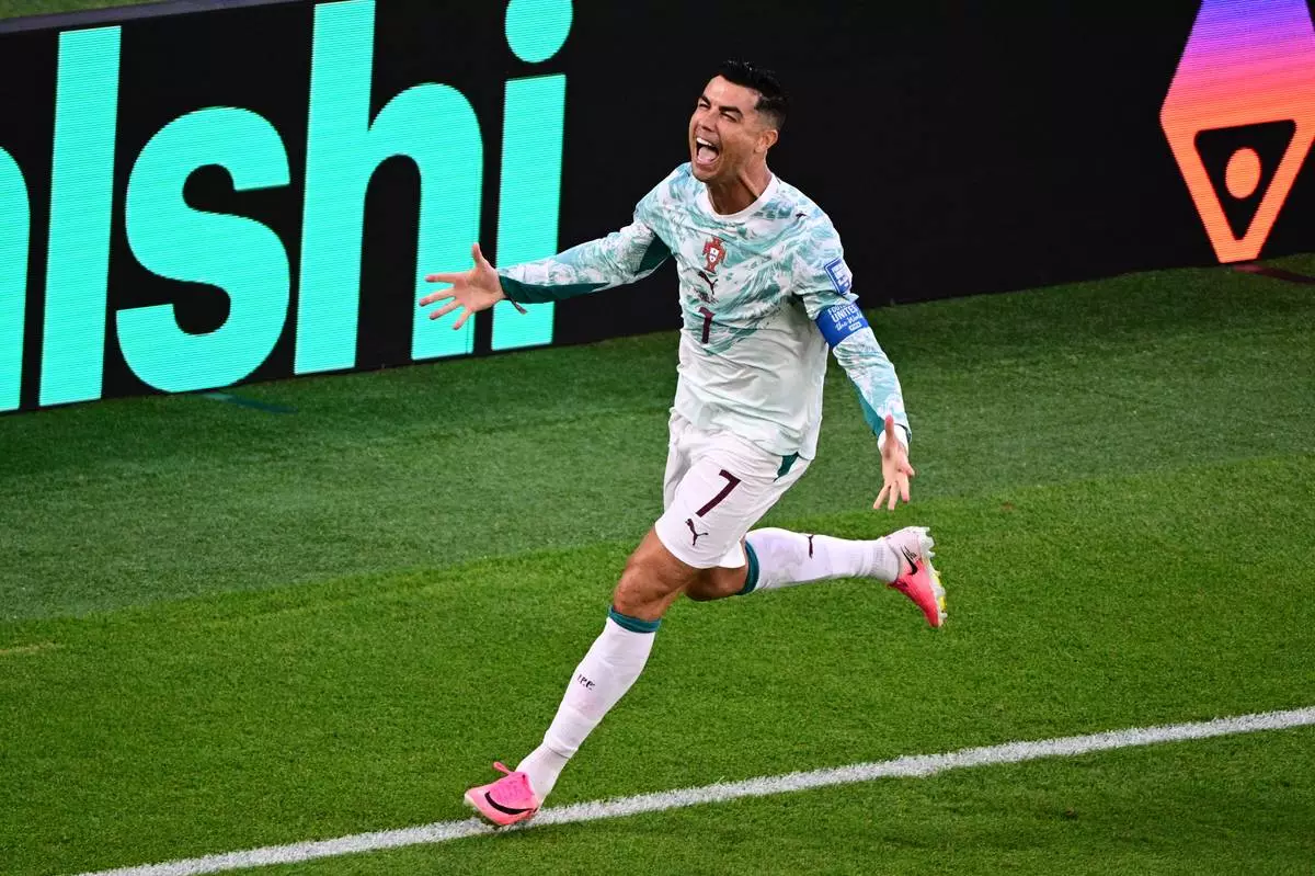 Portugal's Cristiano Ronaldo (7) celebrates after scoring their first a goal on a penalty kick during the World Cup round of 32 soccer match between Portugal and Croatia in Toronto, Thursday, July 2, 2026. (Sammy Kogan/The Canadian Press via AP)