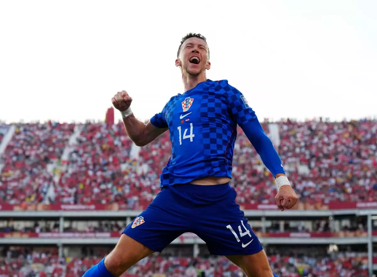 Croatia's Ivan Perisic (14) celebrates after scoring their first goal during the World Cup round of 32 soccer match between Portugal and Croatia in Toronto, Thursday, July 2, 2026. (Chris Young/The Canadian Press via AP)