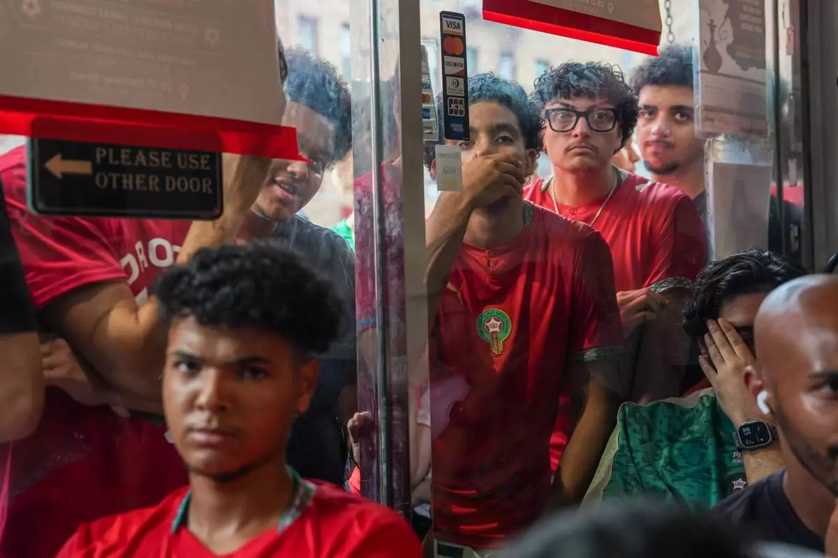 Morocco fans react after an opposing goal while watching the Quarterfinal stage, Morocco vs. France World Cup match, on Thursday, July 9, 2026, in Queens, New York. (AP Photo/Ryan Murphy)