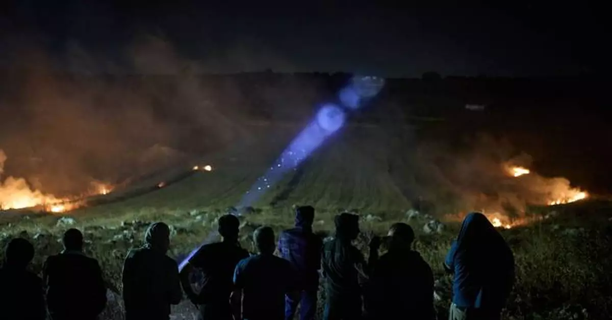 Photos show West Bank Palestinians keeping watch at night as settler violence grows