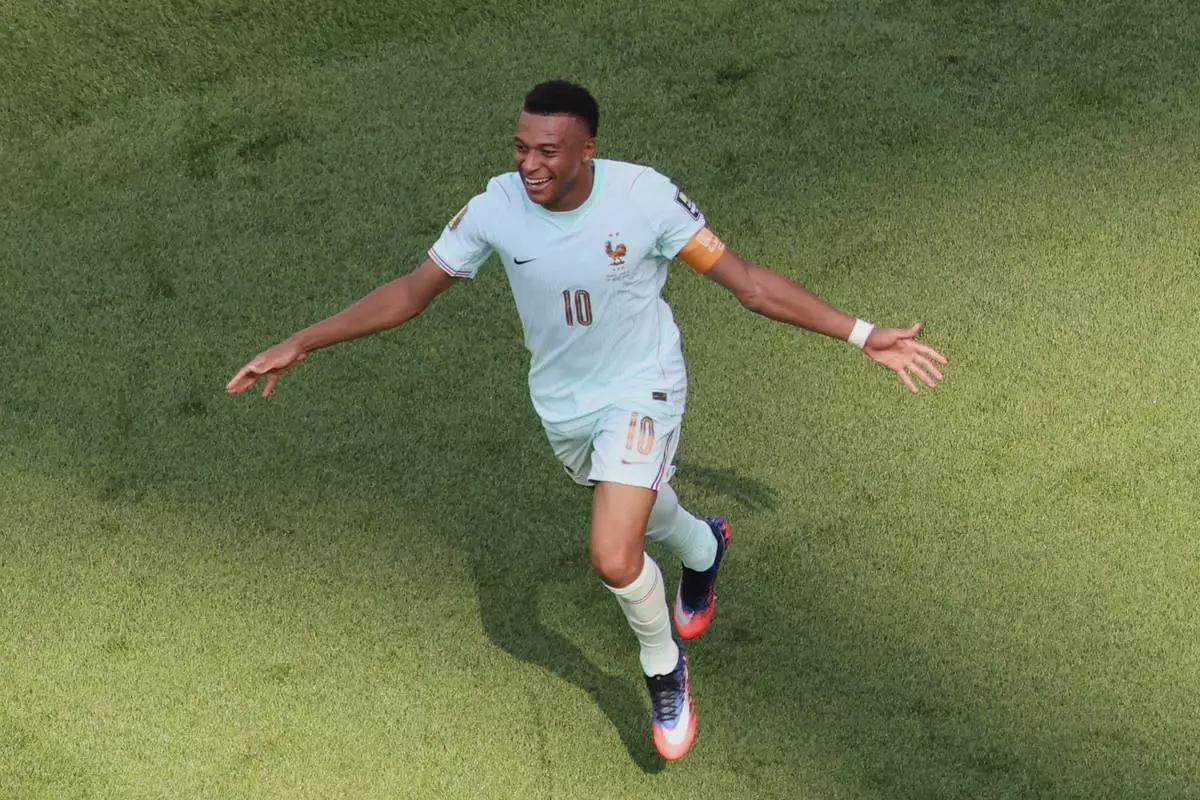 France's Kylian Mbappe (10) celebrates after teammate Ousmane Dembele scored their second goal during the World Cup quarterfinal soccer match against Morocco in Foxborough, Mass., near Boston, Thursday, July 9, 2026. (AP Photo/Mark Stockwell) CORRECTION: Corrects to team's second goal, not first and goal scorer to France's Ousmane Dembele, not Kylian Mbappe.