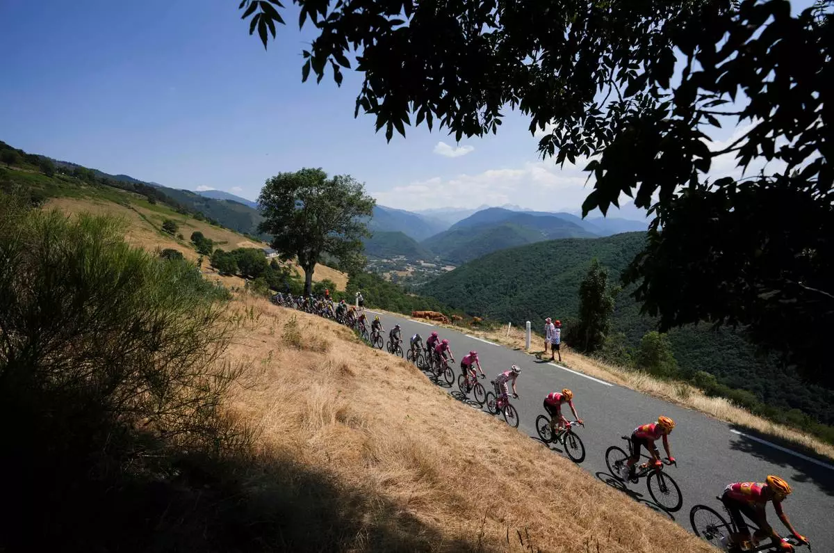 The pack rides during the sixth stage of the Tour de France cycling race over 186 kilometers (115.5 miles) with start in Pau and finish in Gavarnie-Gedre, France, Thursday, July 9, 2026. (AP Photo/Thibault Camus) CORRECTION: Corrects the distance in kilometers.