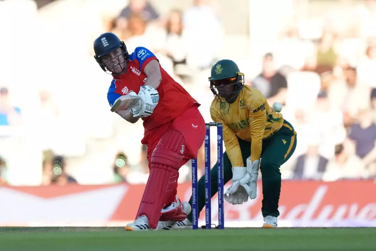 England's Natalie Sciver-Brunt, left, plays a shot during the Women's T20 Cricket World Cup semifinal match between England and South Africa in London, Thursday, July 2, 2026. (AP Photo/Alastair Grant)