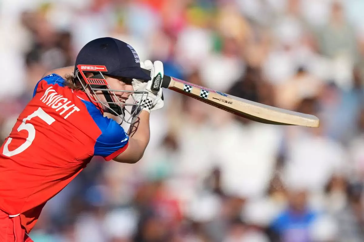 England's Heather Knight plays a shot during the Women's T20 Cricket World Cup semifinal match between England and South Africa in London, Thursday, July 2, 2026. (AP Photo/Alastair Grant)