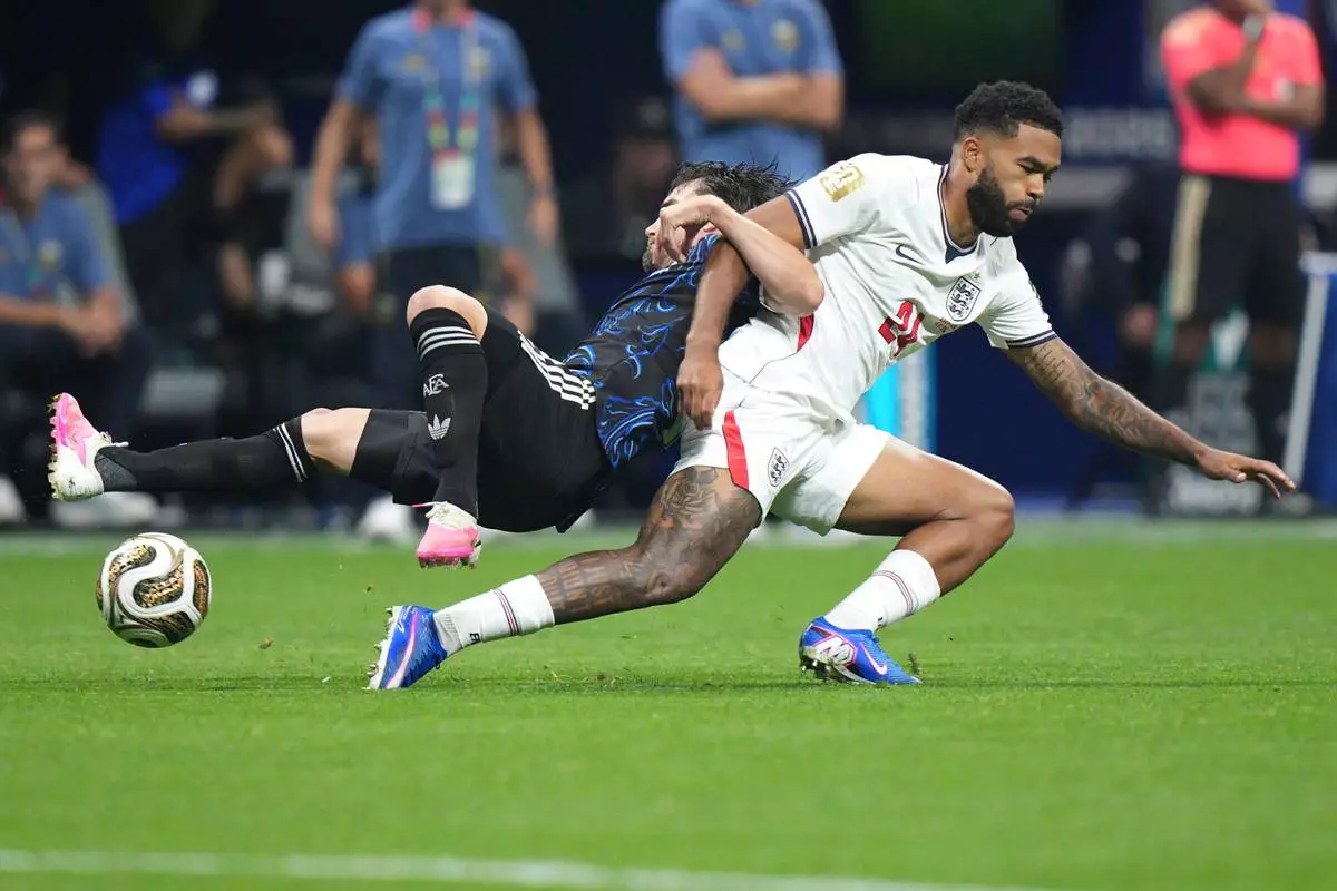 England's Reece James (24) battles for the ball with Argentina's Nicolas Tagliafico (3) during the World Cup semifinal soccer match between England and Argentina in Atlanta, Wednesday, July 15, 2026. (AP Photo/Jacob Kupferman)
