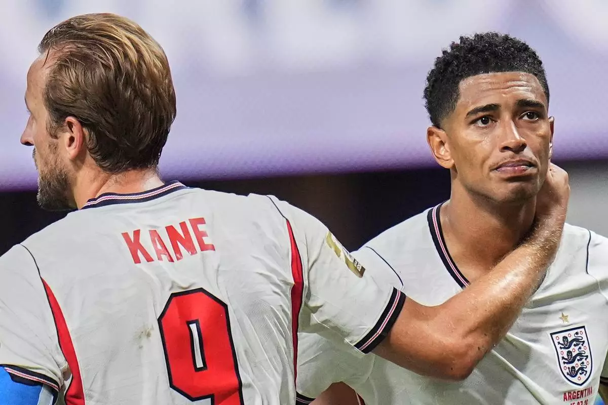 England's Harry Kane (9) and England's Jude Bellingham (10) are dejected at the end of the World Cup semifinal soccer match between England and Argentina in Atlanta, Wednesday, July 15, 2026. (AP Photo/Jeff Roberson)