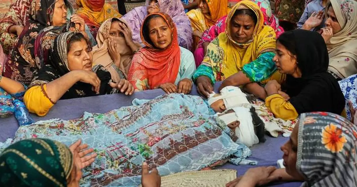 Mourners attend funerals for 14 Pakistani children killed in tutoring center roof collapse