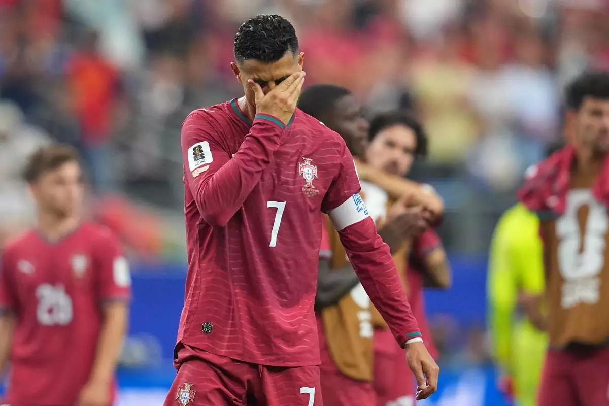 Portugal's Cristiano Ronaldo (7) reacts after the World Cup round of 16 soccer match between Portugal and Spain in Arlington, Texas, near Dallas, Monday, July 6, 2026. (AP Photo/Julio Cortez)