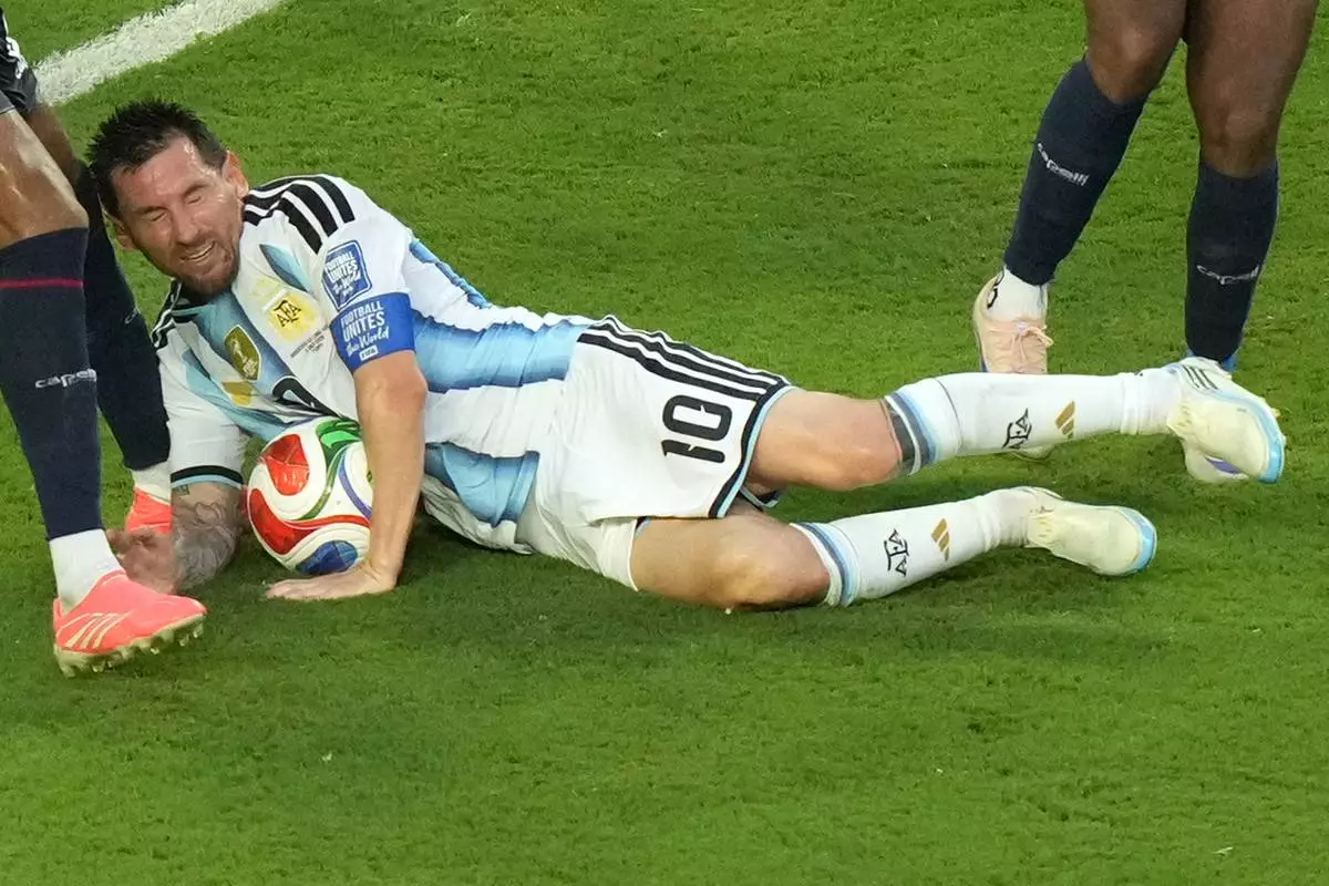 Argentina's Lionel Messi (10) collides with Cape Verde's Kevin Pina (6) during the World Cup round of 32 soccer match between Argentina and Cape Verde in Miami Gardens, Fla., Friday, July 3, 2026. (AP Photo/Marta Lavandier)