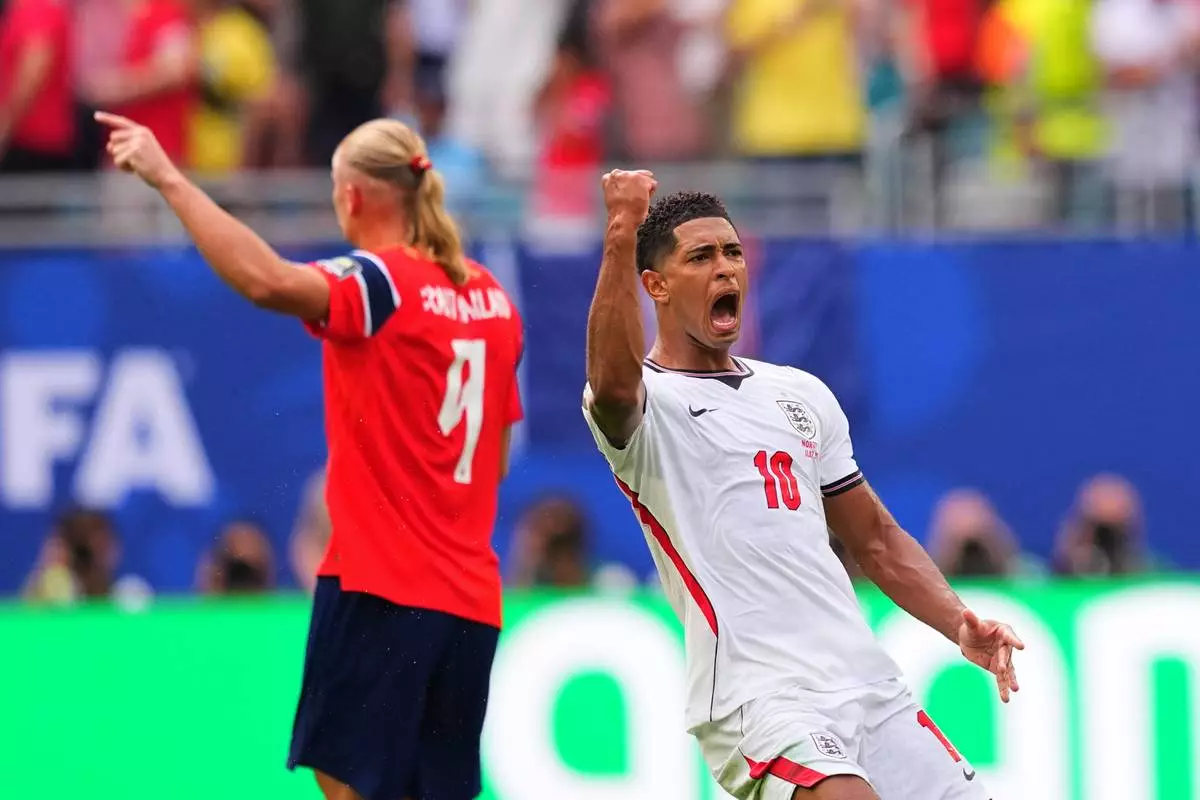England's Jude Bellingham celebrates scoring his side's opening goal against Norway during a World Cup quarterfinal soccer match in Miami Gardens, Fla., Saturday, July 11, 2026. (AP Photo/Julio Cortez)