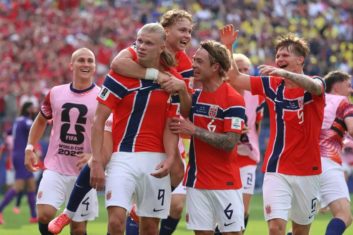 Norway's Erling Haaland (9) celebrates with teammates after scoring their second goal during the World Cup round of 16 soccer match between Brazil and Norway in East Rutherford, N.J., near New York, Sunday, July 5, 2026. (AP Photo/Pamela Smith)