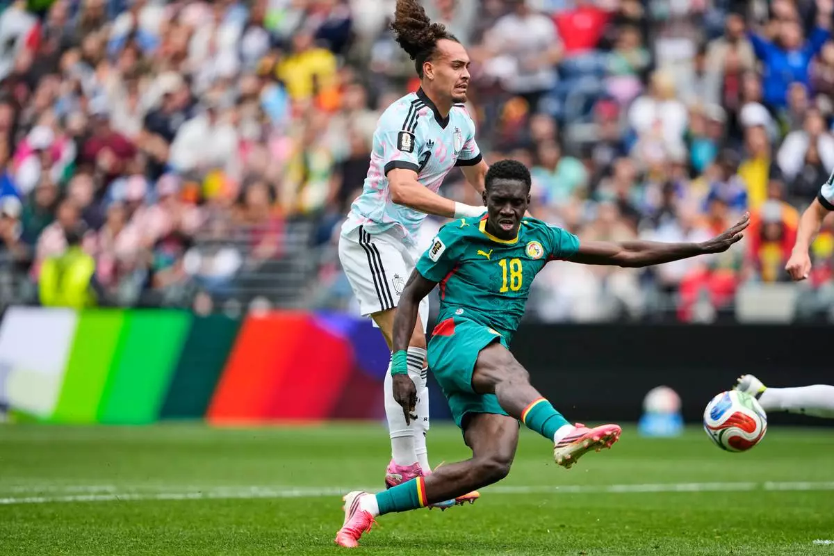 Senegal's Ismaila Sarr (18) scores their second goal during the World Cup round of 32 soccer match between Belgium and Senegal in Seattle, Wednesday, July 1, 2026. (AP Photo/Lindsey Wasson)
