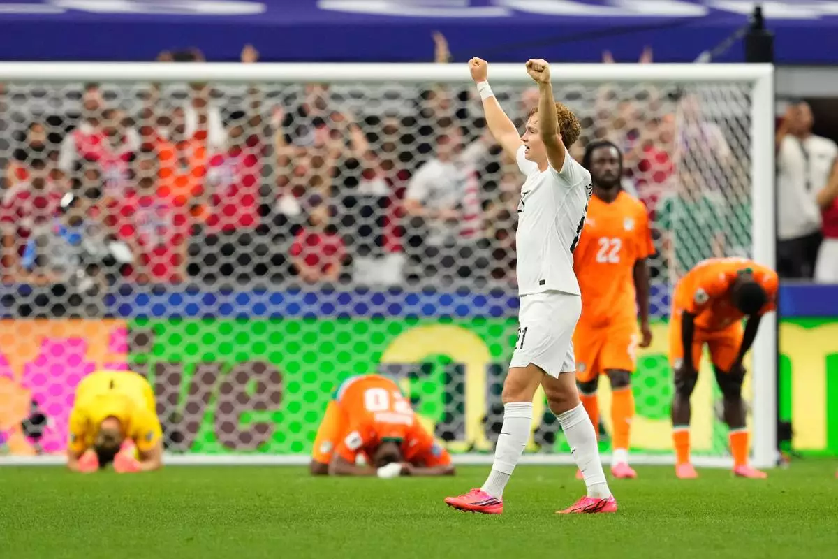 Norway's Andreas Schjelderup (21) celebrates after the victory over Ivory Coast in the World Cup round of 32 soccer match in Arlington, Texas, near Dallas, Tuesday, June 30, 2026.(AP Photo/Tony Gutierrez)