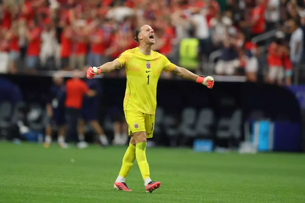 Norway goalkeeper Oerjan Nyland (1) celebrates his side's second goal during the FIFA World Cup Round of 32 soccer match between Ivory Coast and Norway in Arlington, Texas, near Dallas, Tuesday, June 30, 2026.(AP Photo/Gareth Patterson)