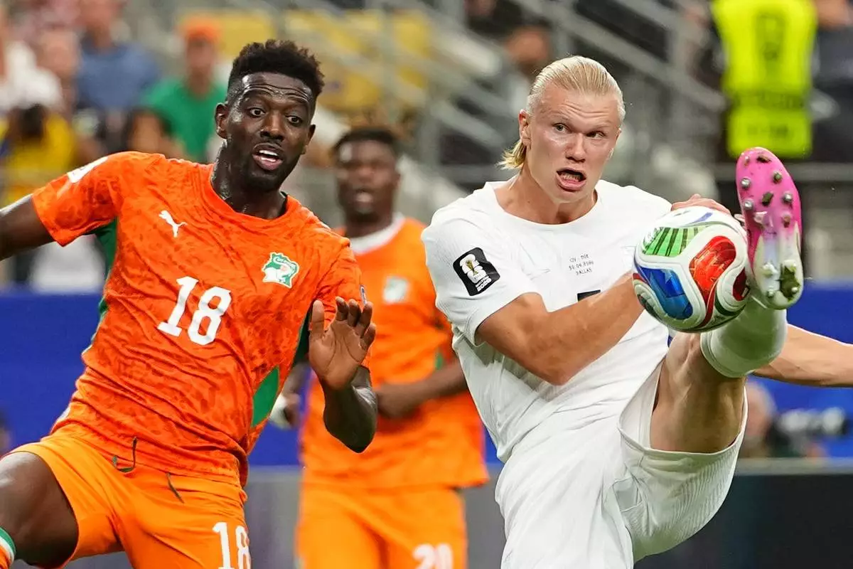 Norway's Erling Haaland (9), right, gets the ball past Ivory Coast's Ibrahim Sangare (18) during the World Cup round of 32 soccer match between Ivory Coast and Norway in Arlington, Texas, near Dallas, Tuesday, June 30, 2026. (AP Photo/Julio Cortez)