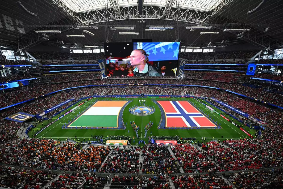 Norway's Erling Haaland (9) is shown on the big screen during teams presentation before the World Cup round of 32 soccer match between Ivory Coast and Norway in Arlington, Texas, near Dallas, Tuesday, June 30, 2026. (AP Photo/Jessica Tobias)