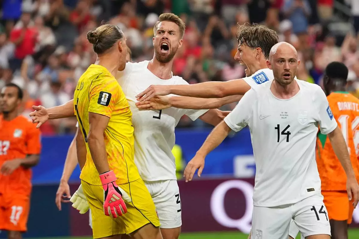 Norway goalkeeper Oerjan Nyland (1) and Norway's Kristoffer Ajer (3) react during the World Cup round of 32 soccer match between Ivory Coast and Norway in Arlington, Texas, near Dallas, Tuesday, June 30, 2026. (AP Photo/Julio Cortez)