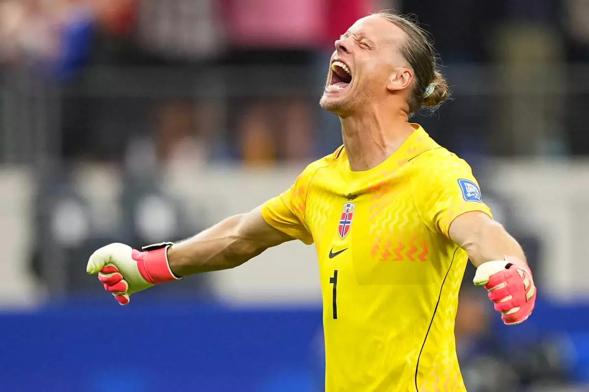 Norway goalkeeper Oerjan Nyland (1) reacts after Erling Haaland (9) scored his side's second goal during the World Cup round of 32 soccer match between Ivory Coast and Norway in Arlington, Texas, near Dallas, Tuesday, June 30, 2026. (AP Photo/Julio Cortez)