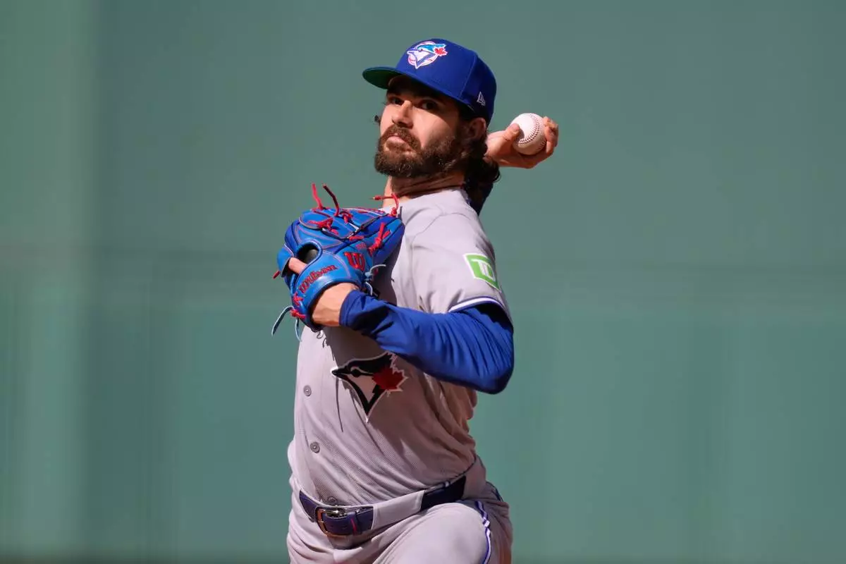 Toronto Blue Jays' Dylan Cease starting pitcher delivers during the first inning of a baseball game against the Boston Red Sox, Saturday, July 25, 2026, in Boston. (AP Photo/Charles Krupa)