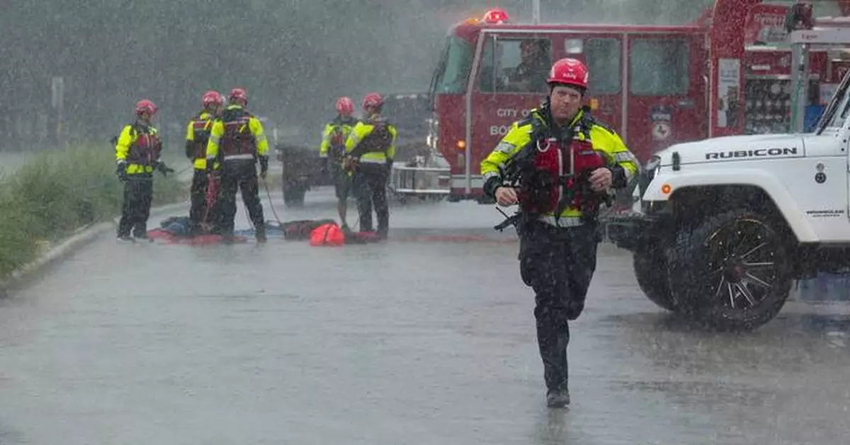Texas flooding surges from huge rainstorms as rescuers pull people from rising waters