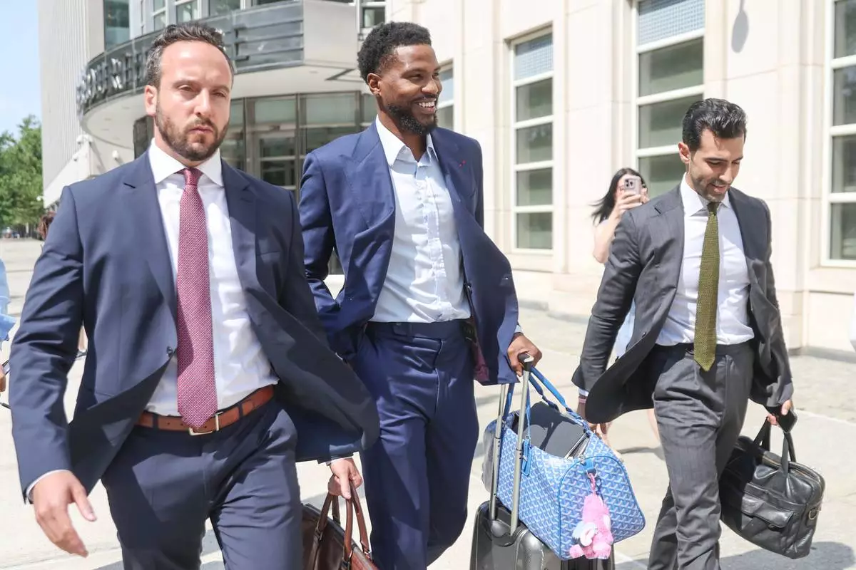 Former NBA player Malik Beasley, center, exits Brooklyn federal court, Wednesday, July 1, 2026, in New York. (AP Photo/Heather Khalifa) CORRECTION: name of the photographer corrected to Heather Khalifa instead of Yuki Iwamura