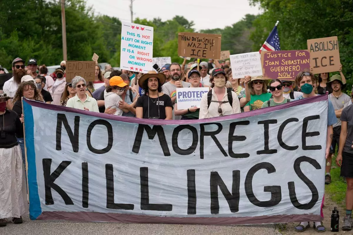 Protesters gather near a U.S. Immigration and Customs Enforcement facility Scarborough, Maine, one day after the shooting of Johan Sebastián Durán Guerrero, Tuesday, July 14, 2026. (AP Photo/Robert F. Bukaty) CORRECTION: Corrects ID to Johan Sebastián Durán Guerrero NOT Joan Sebastian Guerrero