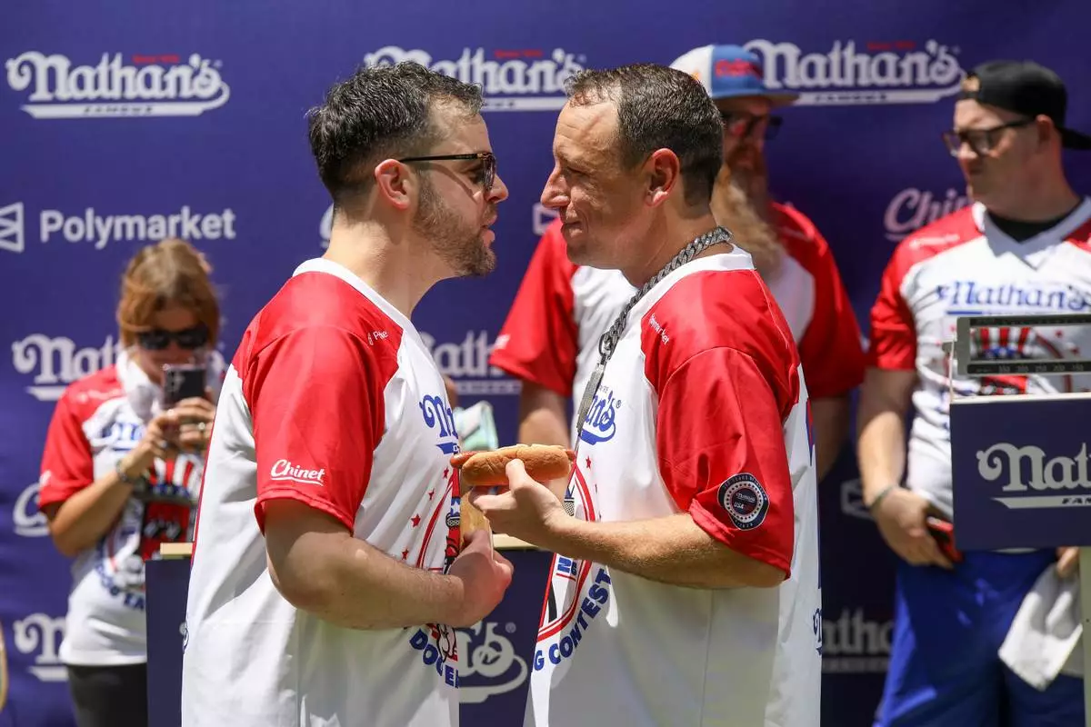 Patrick Bertoletti, left, and Joey Chestnut participate in the Nathan's Famous Fourth of July International Hot Dog Eating Contest weigh-in ceremony at Hudson Yards on Friday, July 3, 2026, in New York. (Photo by Andy Kropa/Invision/AP)