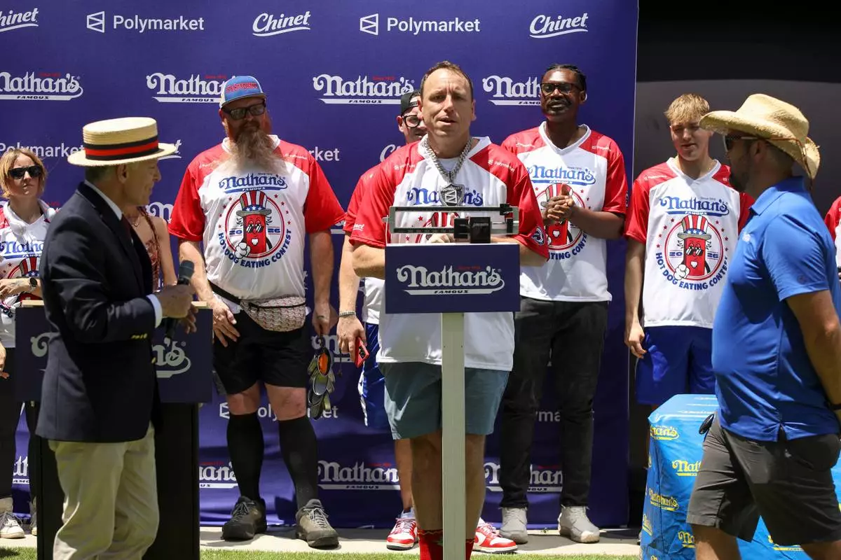 Joey Chestnut stands on a scale at the Nathan's Famous Fourth of July International Hot Dog Eating Contest weigh-in ceremony at Hudson Yards on Friday, July 3, 2026, in New York. (Photo by Andy Kropa/Invision/AP)