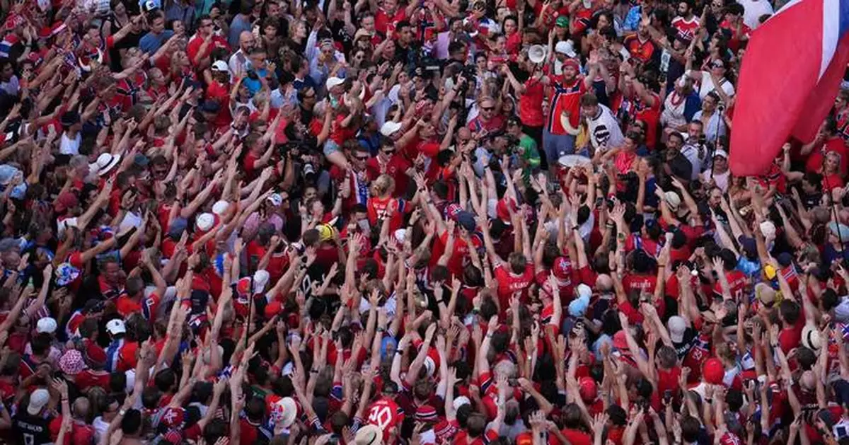 One Extraordinary Photo: Red-clad Norway fans who have become a World Cup sensation