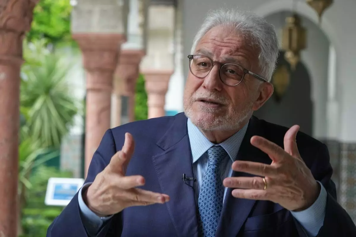 Rector of Paris' Grand Mosque Chems-eddine Hafiz, gestures as he speaks during an interview with the Associated Press, as it celebrates its 100th anniversary in Paris, Friday, July 17, 2026. (AP Photo/Michel Euler)