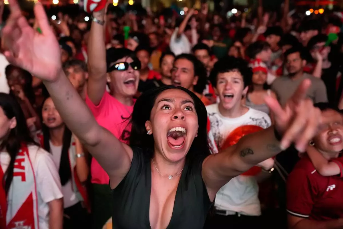 Fans watching on a big screen in Lisbon, Portugal, react after VAR disallowed a second goal by Croatia in the last minute of the World Cup round of 32 soccer match between Portugal and Croatia, Friday, July 3, 2026 . (AP Photo/Armando Franca)