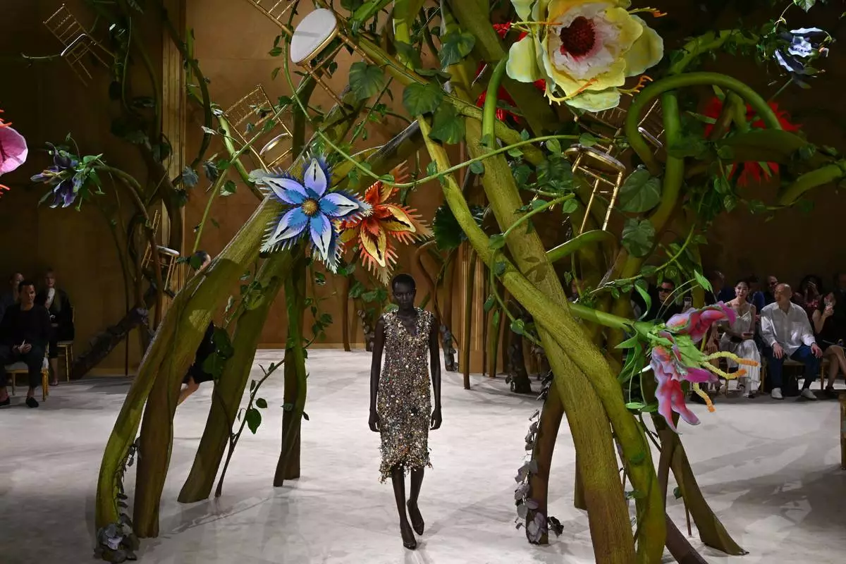 A model wears a creation as part of the Chanel Haute Couture Fall/Winter 2026-2027 Women's collection presented in Paris, Tuesday, July 7, 2026. (AP Photo/Emma Da Silva)