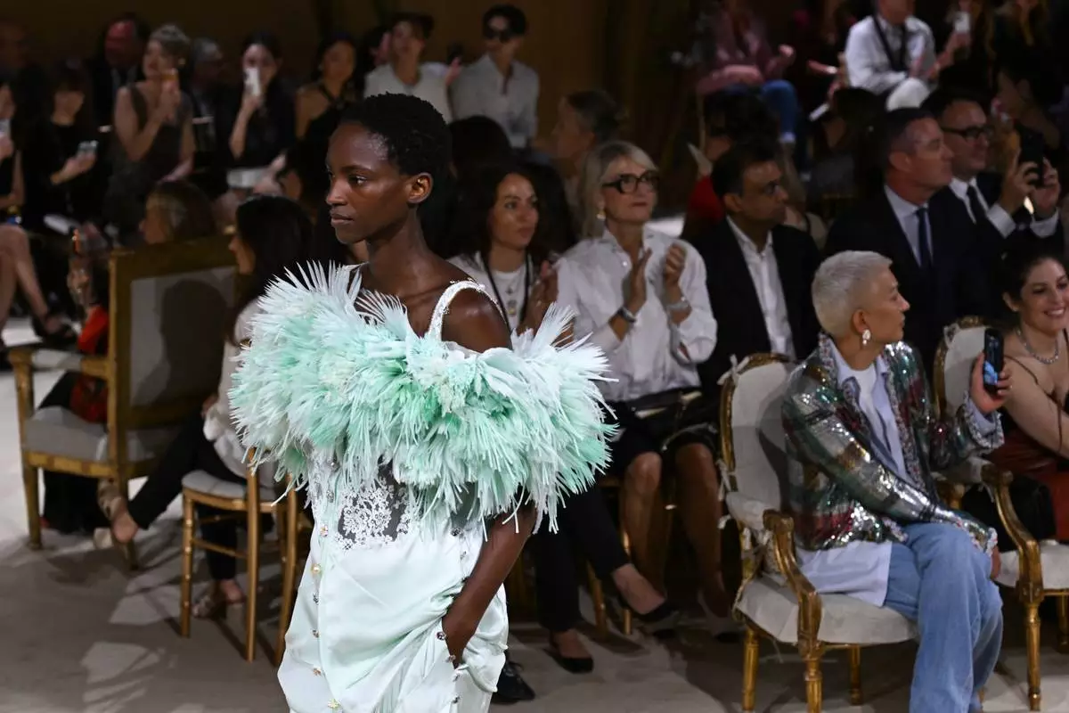 A model wears a creation as part of the Chanel Haute Couture Fall/Winter 2026-2027 Women's collection presented in Paris, Tuesday, July 7, 2026. (AP Photo/Emma Da Silva)